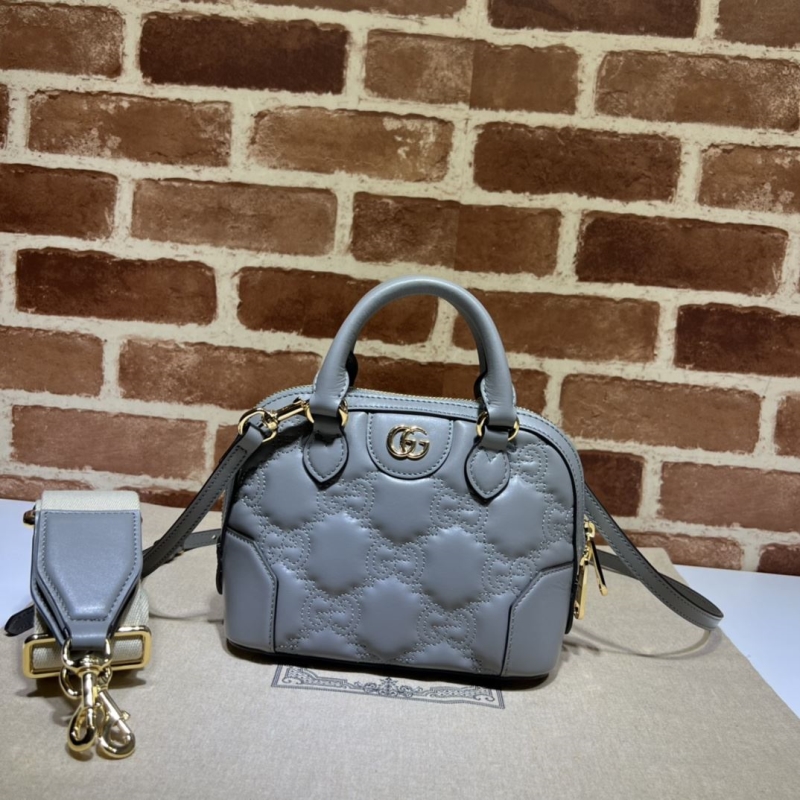 G*u*i top handle bags